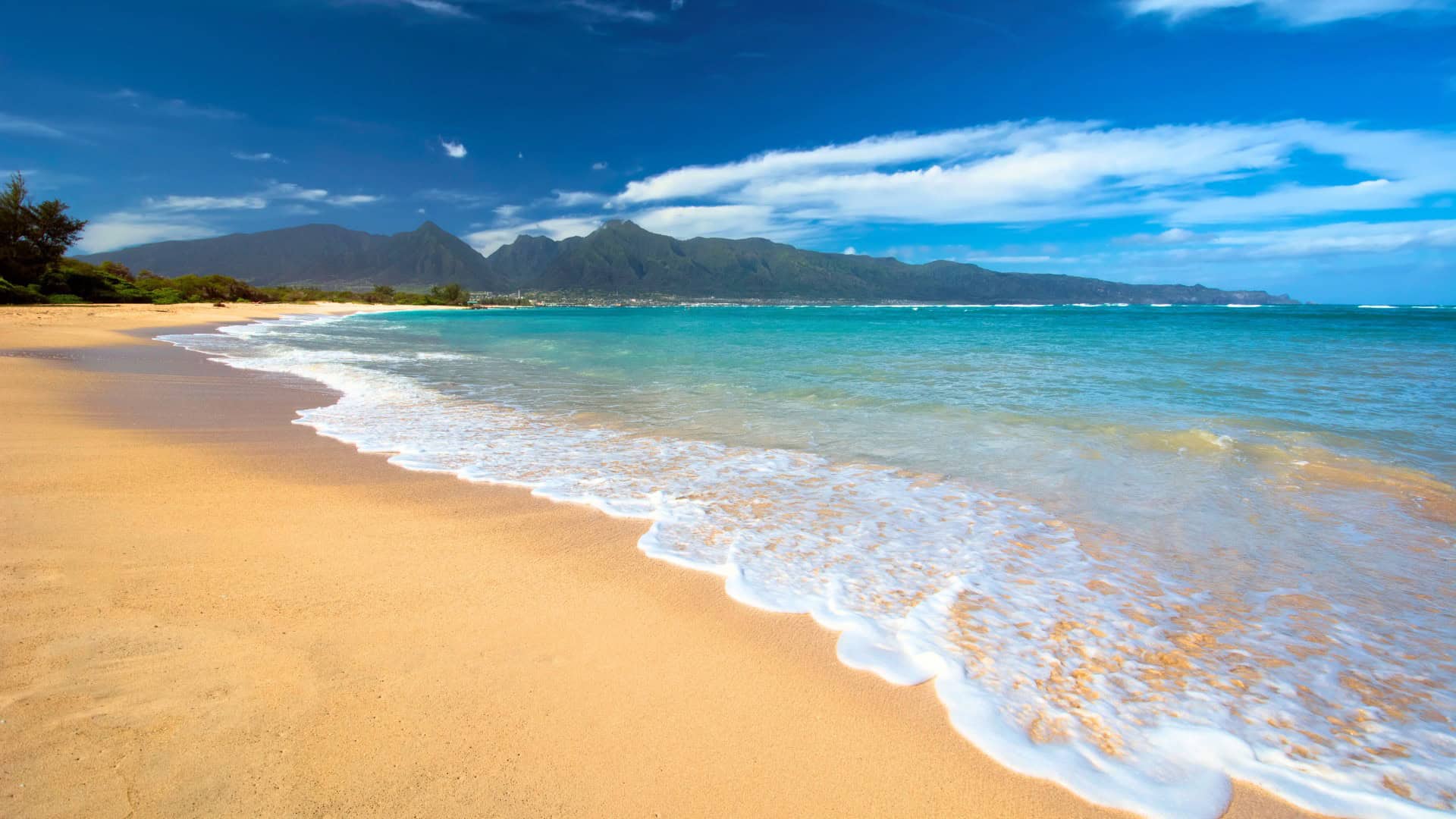 Beautiful Kahana Beach Park with West Maui Mountains backdrop on Maui